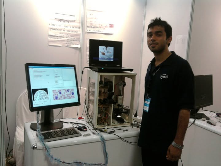 Kushagra Thakur at Intel-branded competition booth with Little Doc system
